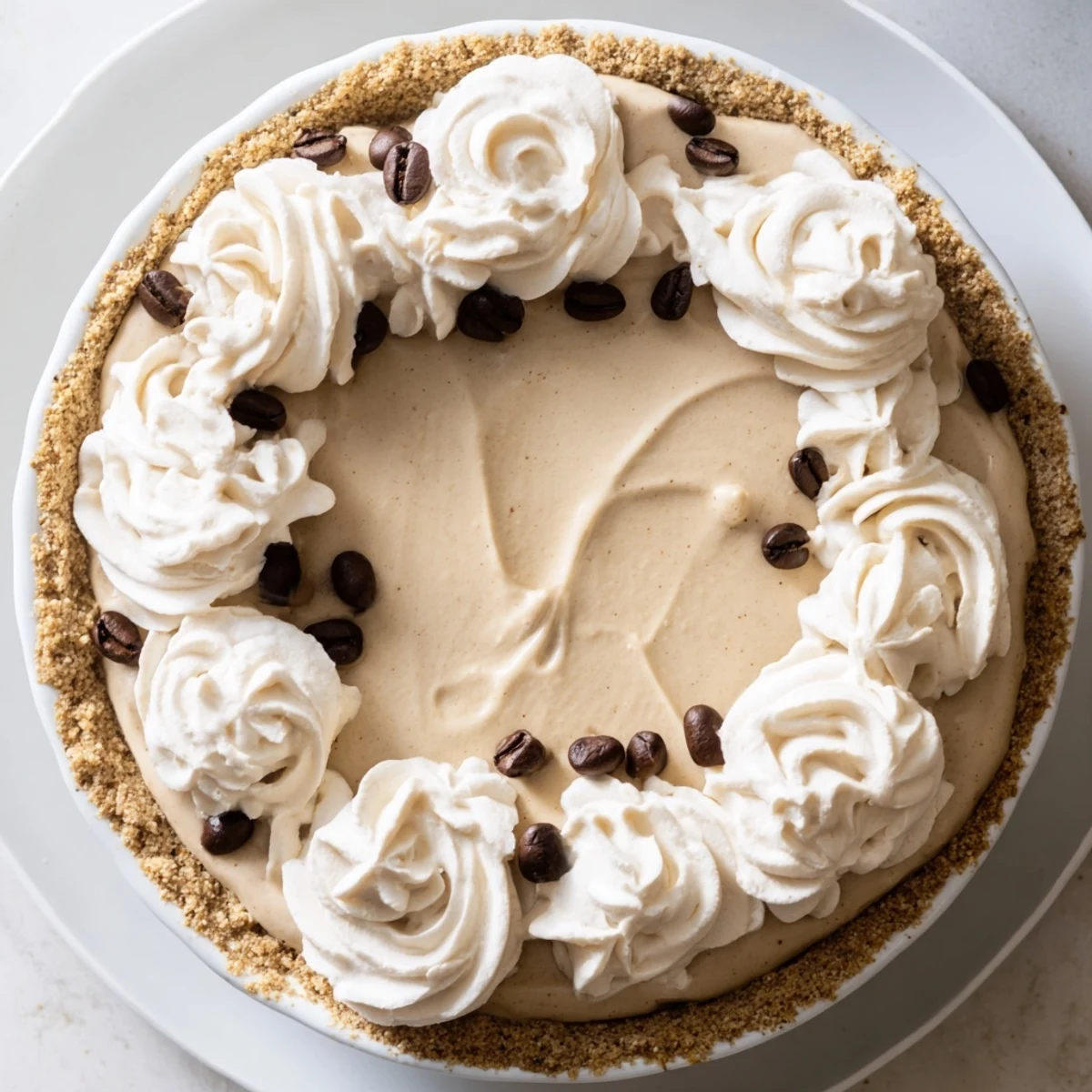 Close-up of a fork cutting into the Keto Cold Brew Coffee Pie, highlighting the rich, dark filling against the crunchy low-carb crust.