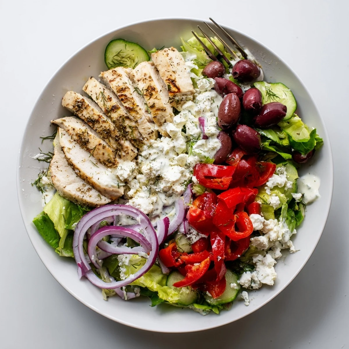 A vibrant bowl of Tzatziki Chicken Salad with Greek flavors and a refreshing cucumber-yogurt dressing.