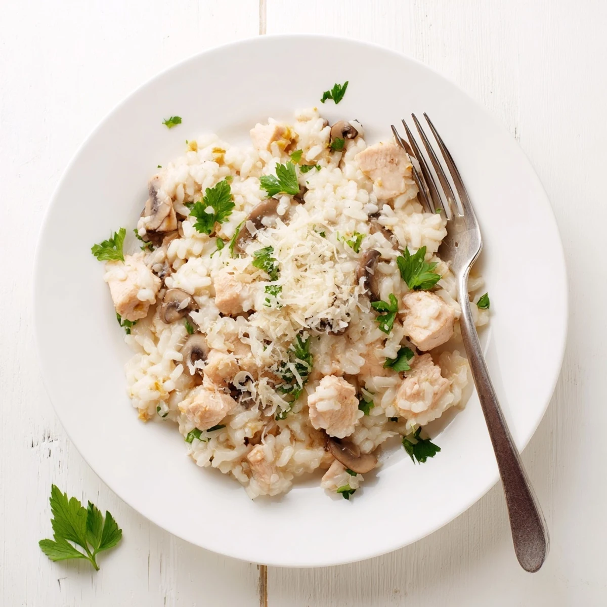 Golden chicken pieces and earthy mushrooms nestled in rich, cheesy Arborio rice baked to tender perfection
