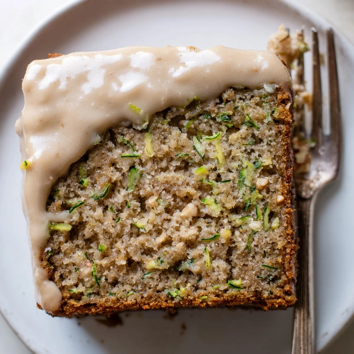 Tray of Zucchini Cake With Brown Sugar Icing, golden edges and warm cinnamon aroma