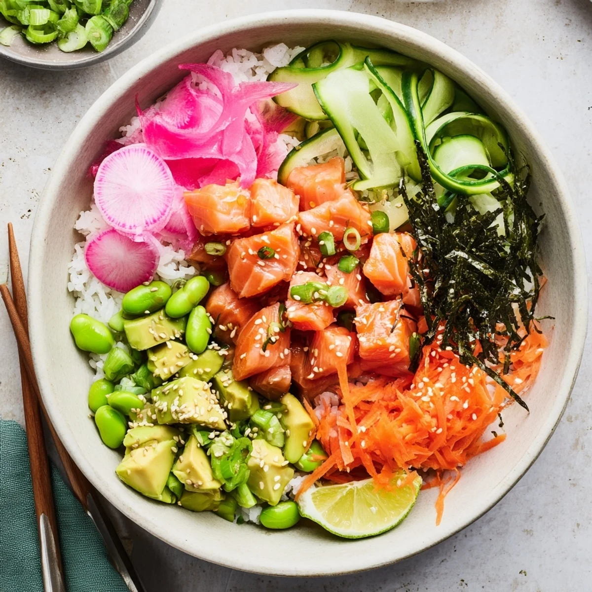 Vibrant salmon and avocado poke bowl with fresh vegetables over seasoned sushi rice