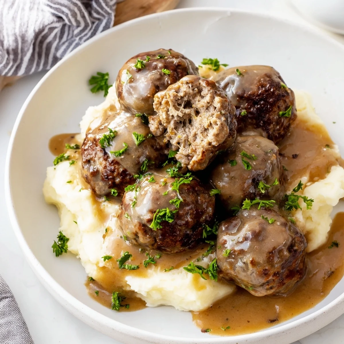 Hearty Crockpot Meatballs Gravy ladled hot into bowl, parsley garnish steaming.